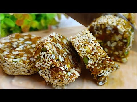 No-Bake Nut Seed and Dried Fruit Log — A rolled no-bake dessert of toasted pumpkin and sunflower seeds with sesame, wal
