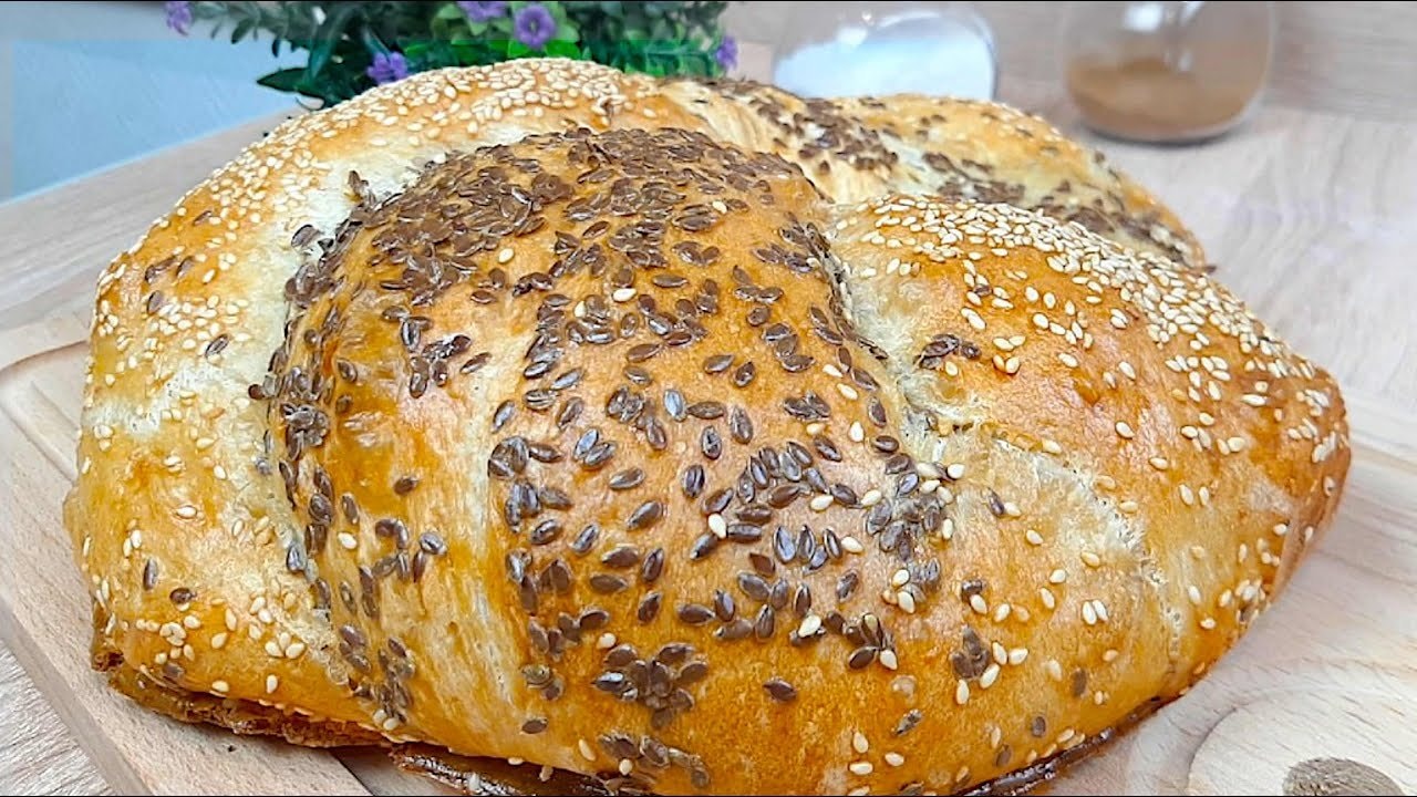 Rustic Artisan Seeded Bread with Flax & Sesame — A rustic folded artisan bread topped with flax and sesame seeds. Two short rises