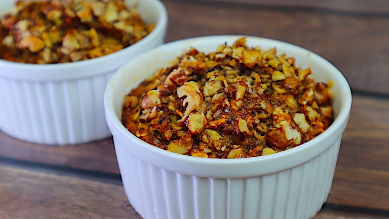 Baked Oatmeal Banana Chocolate Cups — Single-serve baked oatmeal cups with mashed banana, chocolate, walnuts and a whi